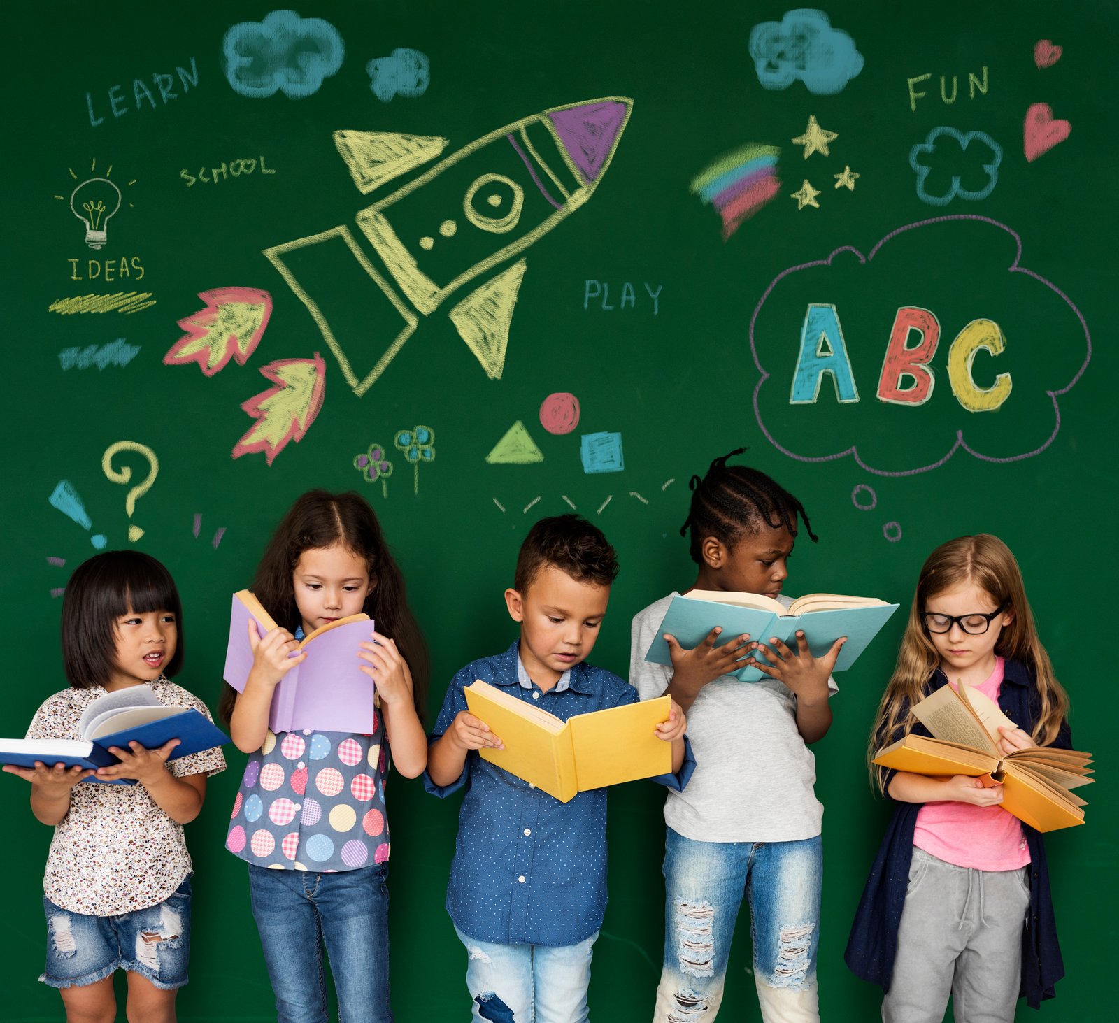 Diverse children reading books together during a learning activity